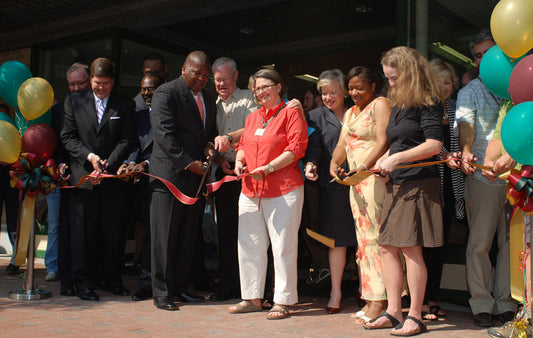 The mayor, Columbia Store staff, and dignitaries gather to cut the ribbon on Main Street on May 25, 2011