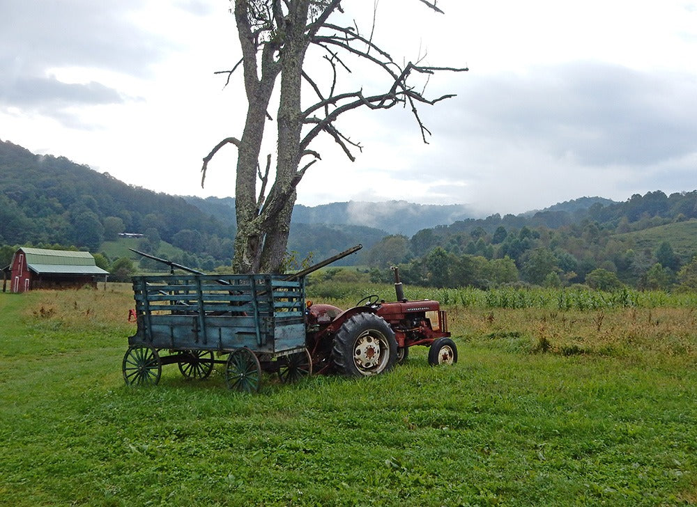 A tractor sits in the field below the Valle Crucis Conference Center