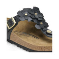 Birkenstock sandals featuring a black floral design with a gold buckle and a comfortable cork footbed, ideal for casual summer wear.