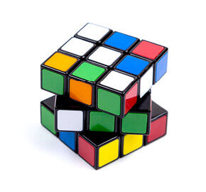 Rubik's Cube with multicolored squares on a white background