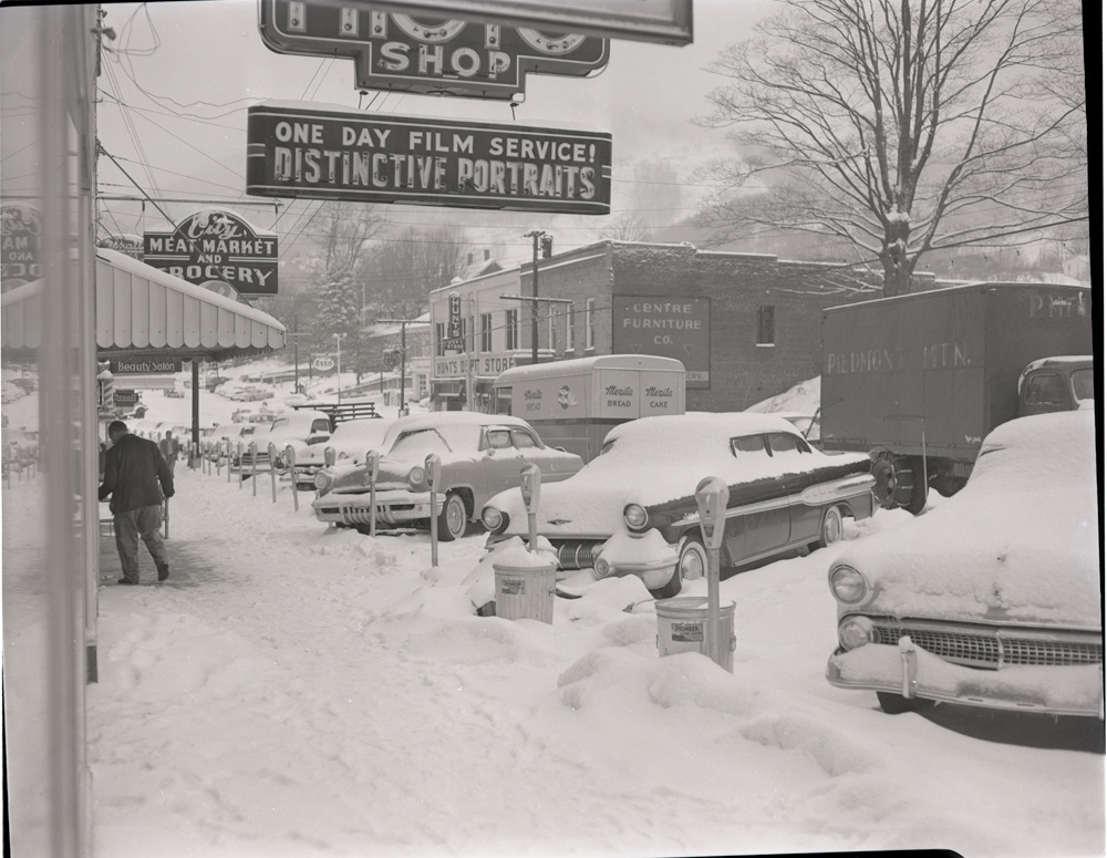 Mast Store in Downtown Boone after a snow, Centre Furniture sign on building, ca. 1954