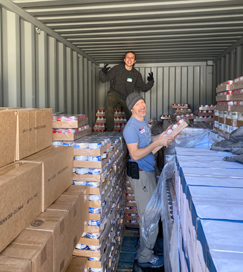 Austin and Fox restack pallets in the storage pods