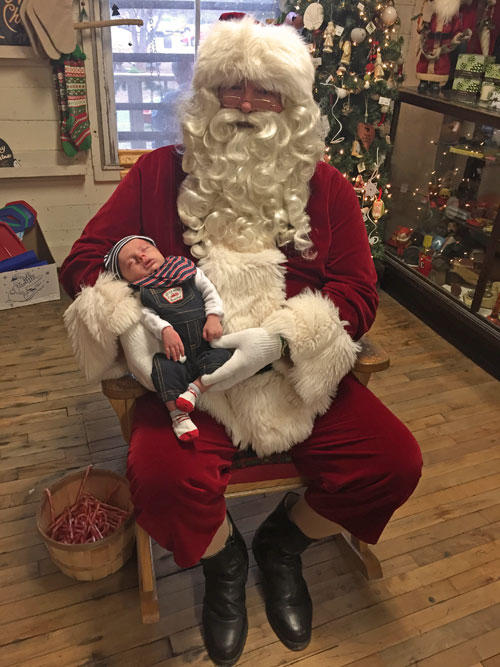 Molly's son visits with Santa at the Original Store. The little one is 1 month old.